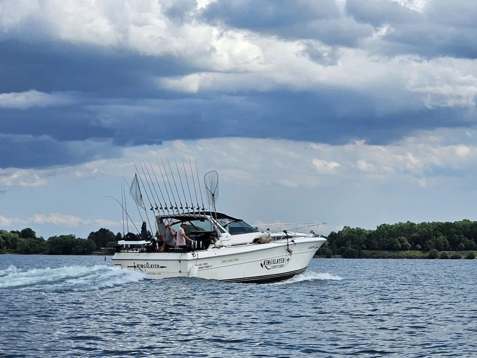 The Kingslayer charter boat running under a dramatic sky on Lake Ontario